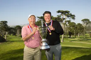 Todd White, left, and Nathan Smith, right, pose with the trophy after winning during the final round of match play at the 2015 U.S. Amateur Four-Ball at The Olympic Club (Lake Course) in San Francisco, Calif. on Wednesday, May 6, 2015.  (Copyright USGA/Darren Carroll)